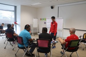 condrey liu standing conducting his mock class